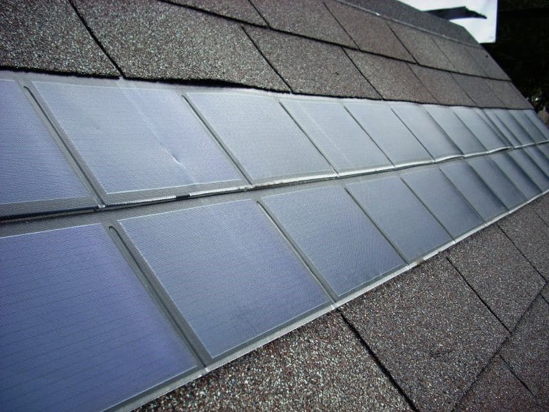 A roof installed with two lines of solar shingles in the middle