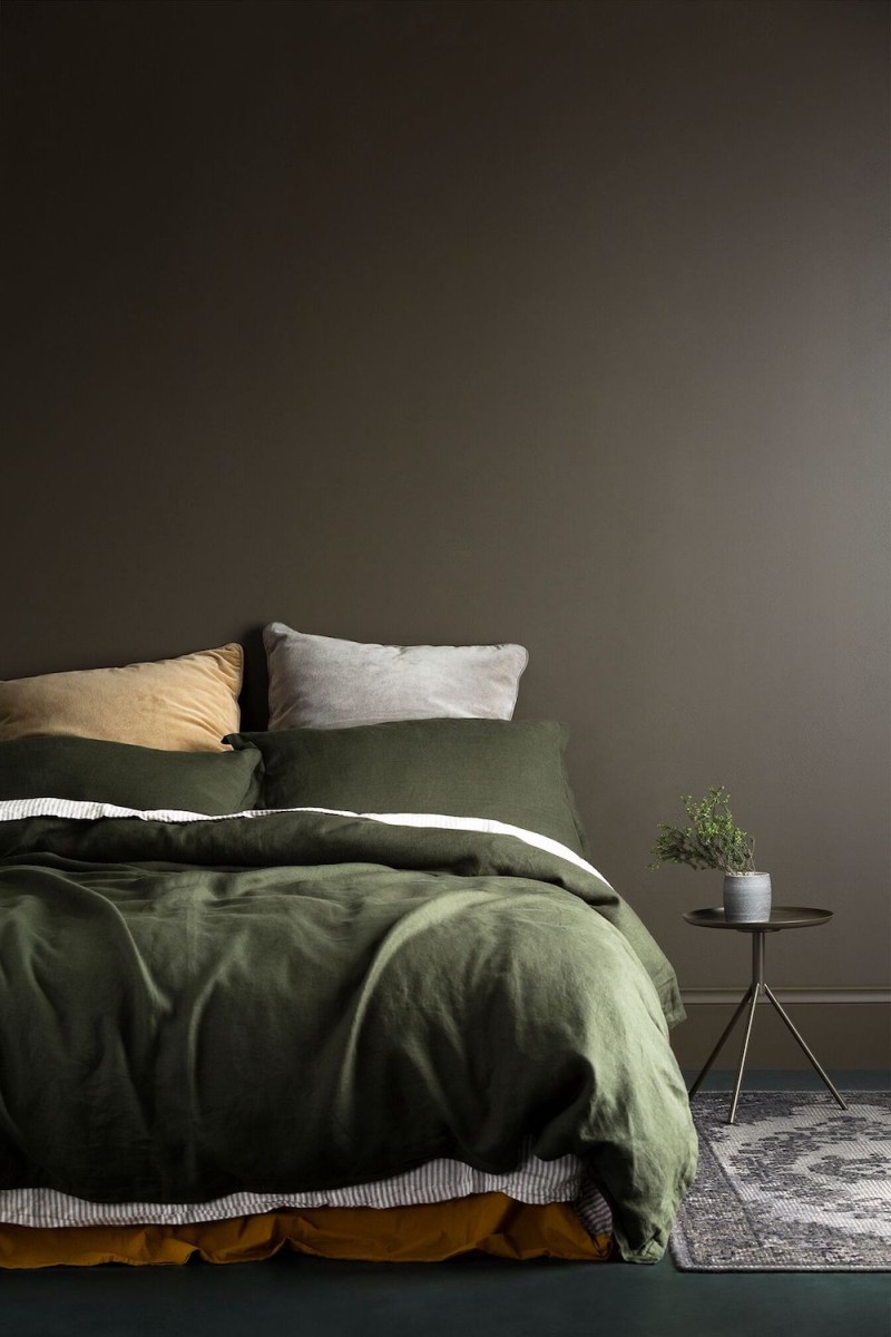 green bedding with grey walls