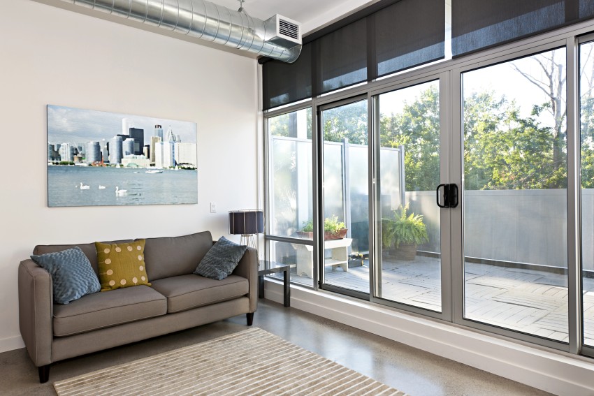 sliding door in living room leading to a patio